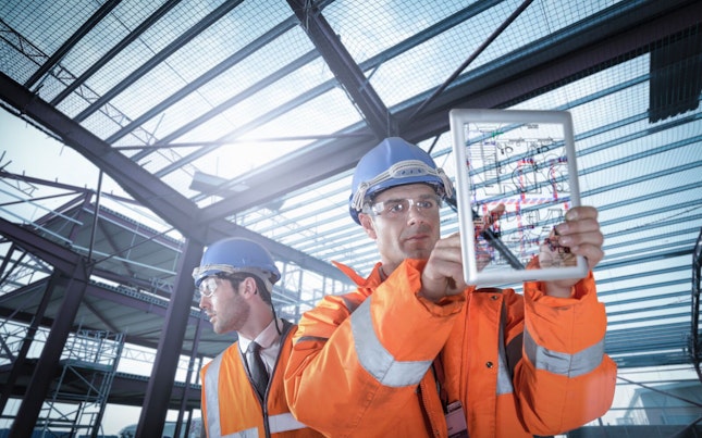 construction-engineers-working-on-plan-details-using-digital-tablet.cdn