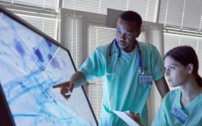 doctors-checking-microorganism-on-big-screen.cdn