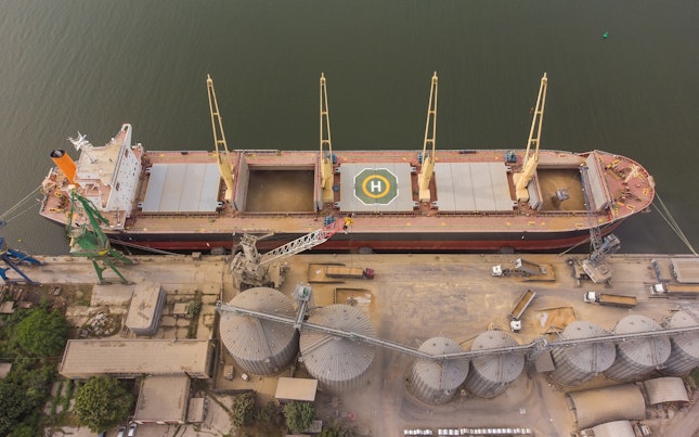 loading-grain-into-holds-of-sea-cargo-vessel-in-seaport-from-silos-of-grain-storage-bunkering-of-dry.cdn
