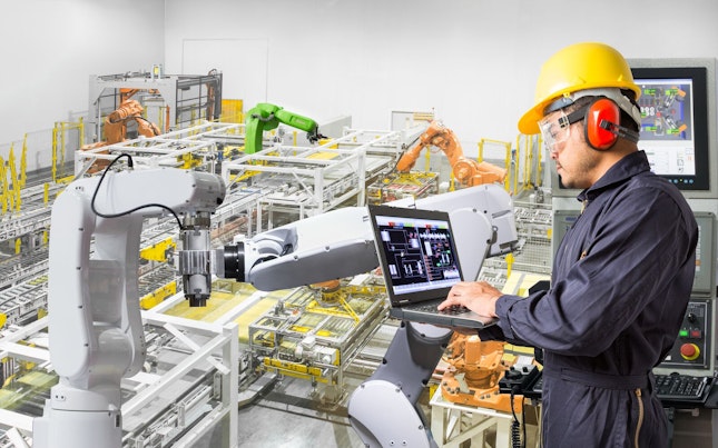 engineer-using-laptop-computer-for-maintenance-automatic-robotic.cdn